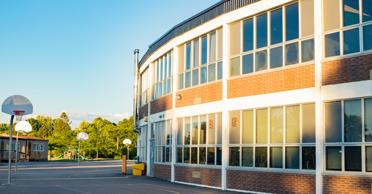 School building with basketball goal