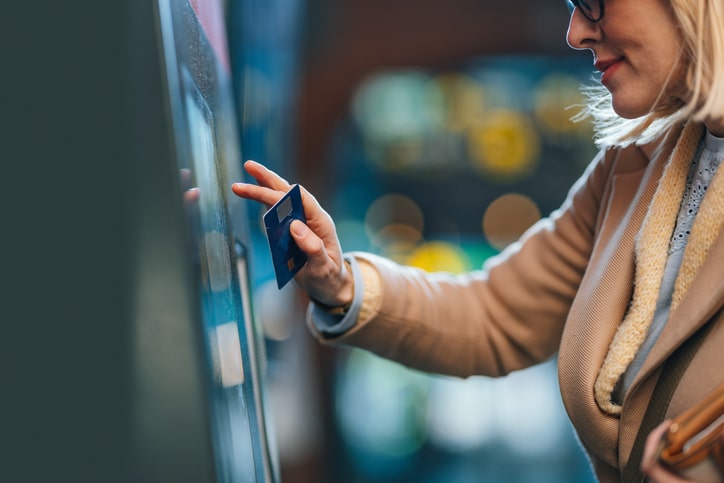 woman using Euna payments kiosk