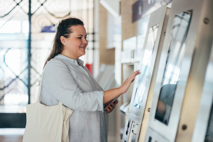 woman using Euna payments kiosk