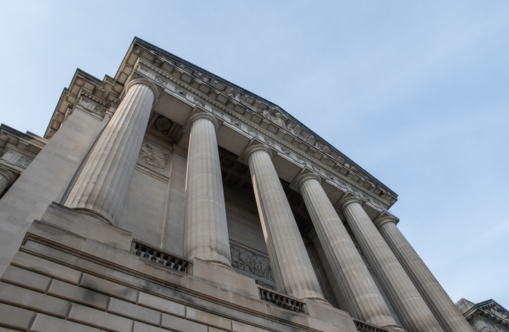 Government building for Euna Grants grant managers against blue sky