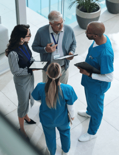 healthcare workers meeting in hallway
